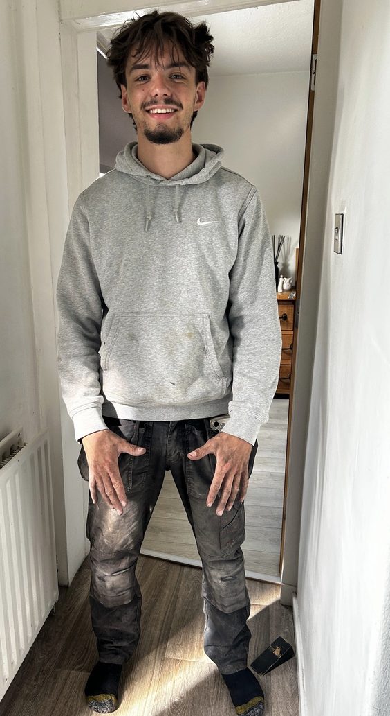 Zak, covered in dust and mud after a day's electrical work